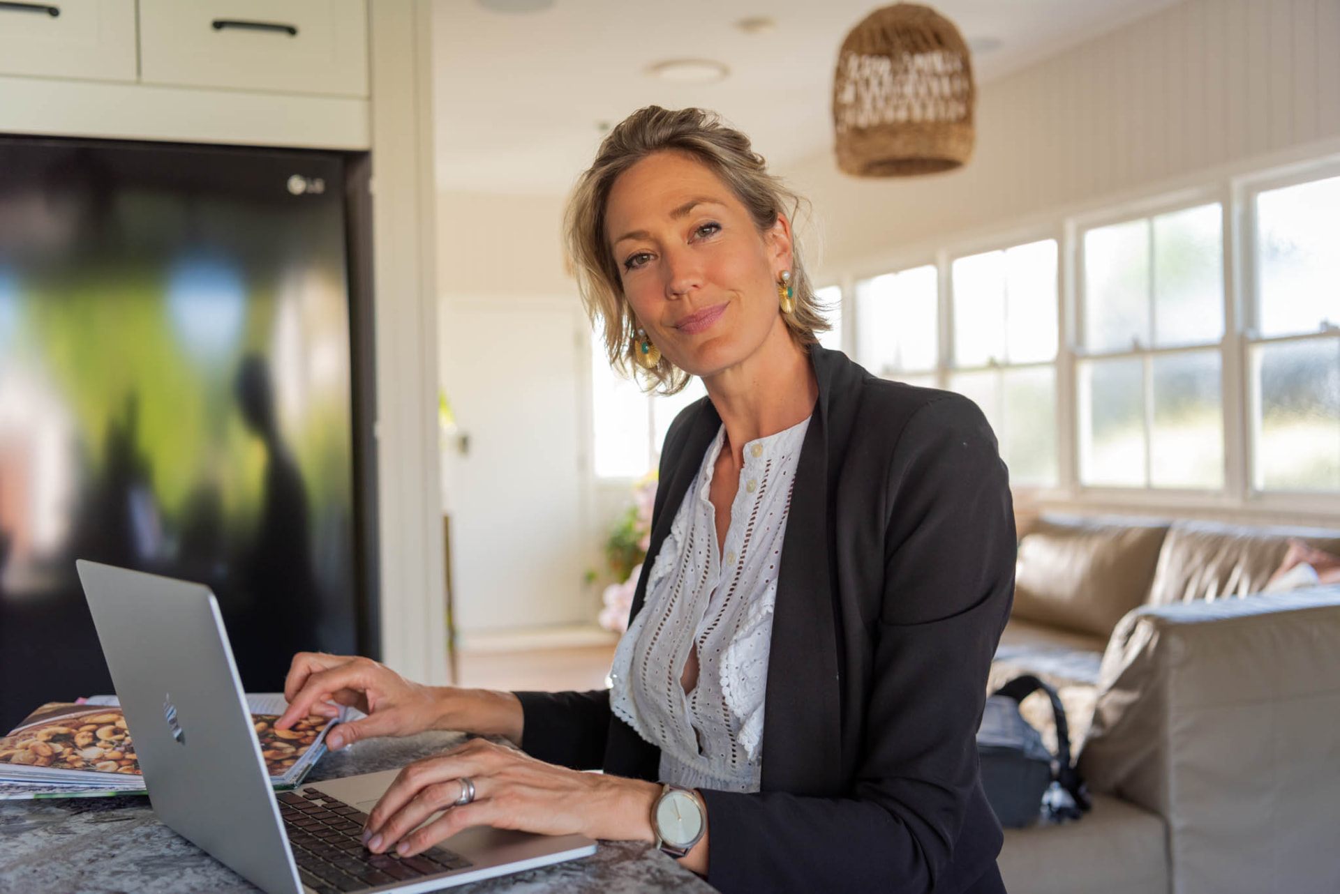 Gemma working on a laptop in a calm, light-filled home space